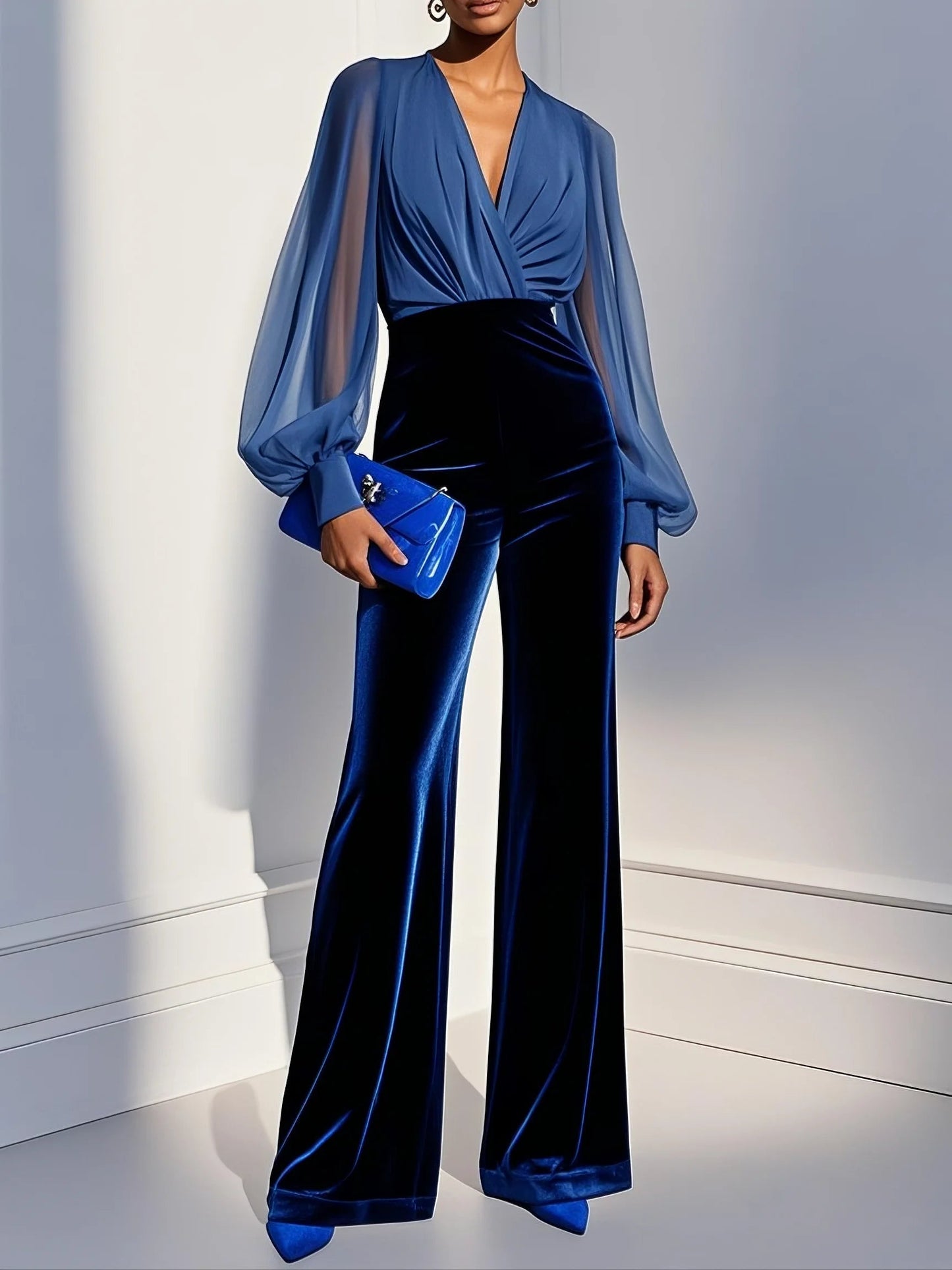 Elegant blue jumpsuit with mesh trim