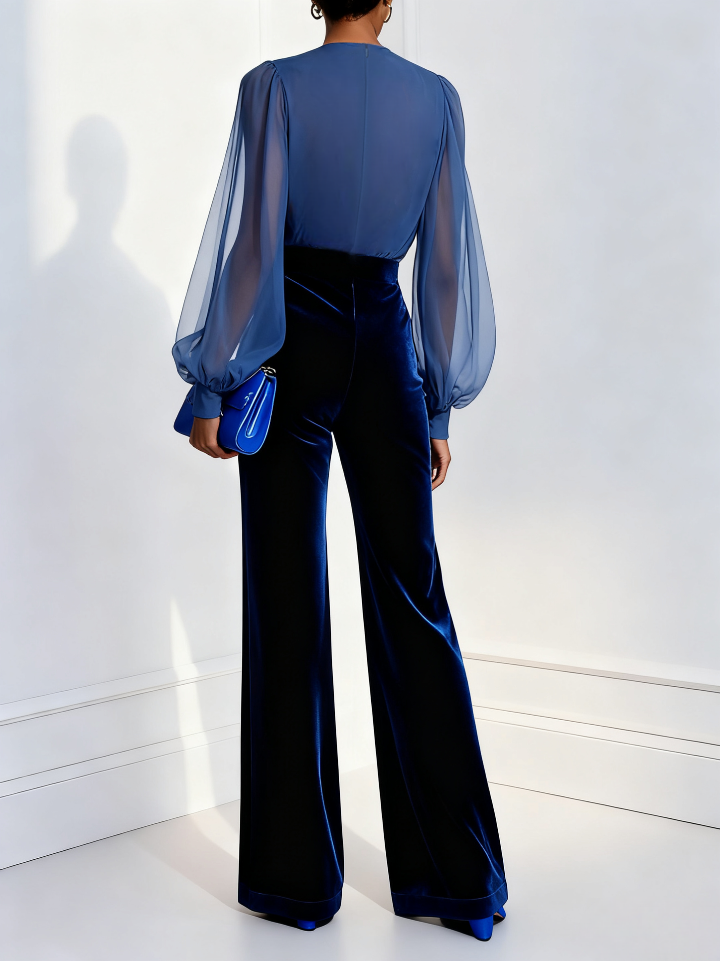 Elegant blue jumpsuit with mesh trim