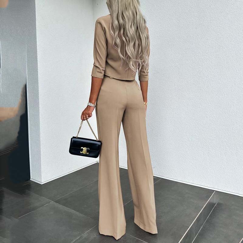 Elegant outfit with crop top and wide-leg pants.