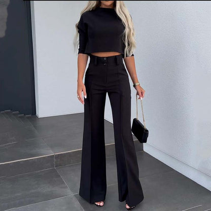 Elegant outfit with crop top and wide-leg pants.