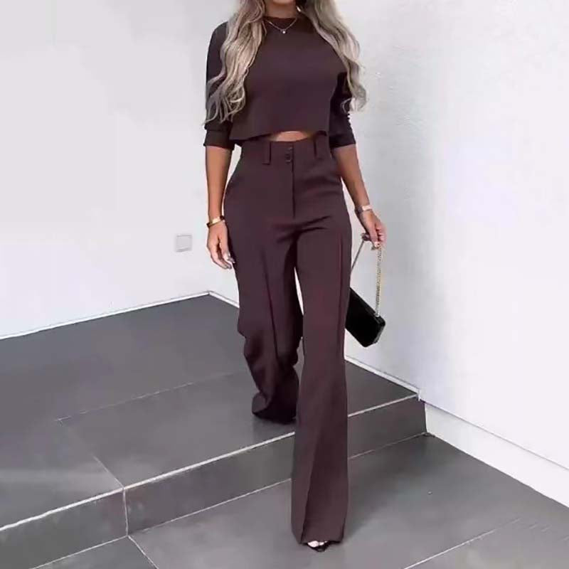 Elegant outfit with crop top and wide-leg pants.