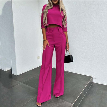 Elegant outfit with crop top and wide-leg pants.